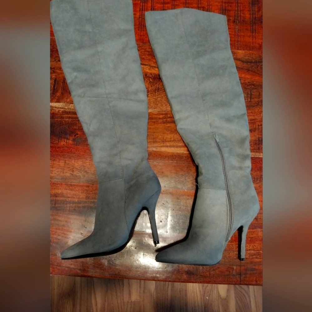 Over the thigh grey boots.
